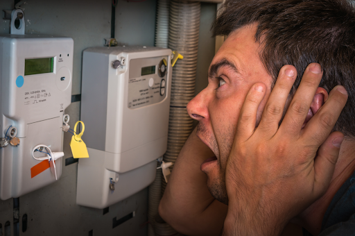 Homeowner looking at horror at high electricity consumption